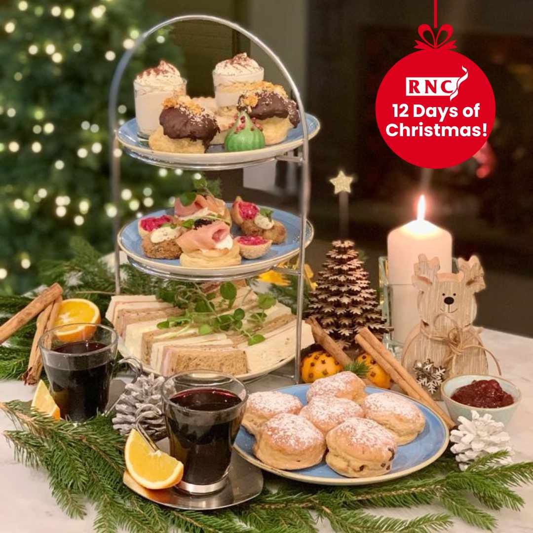 An afternoon tea laid out with a Christmas theme