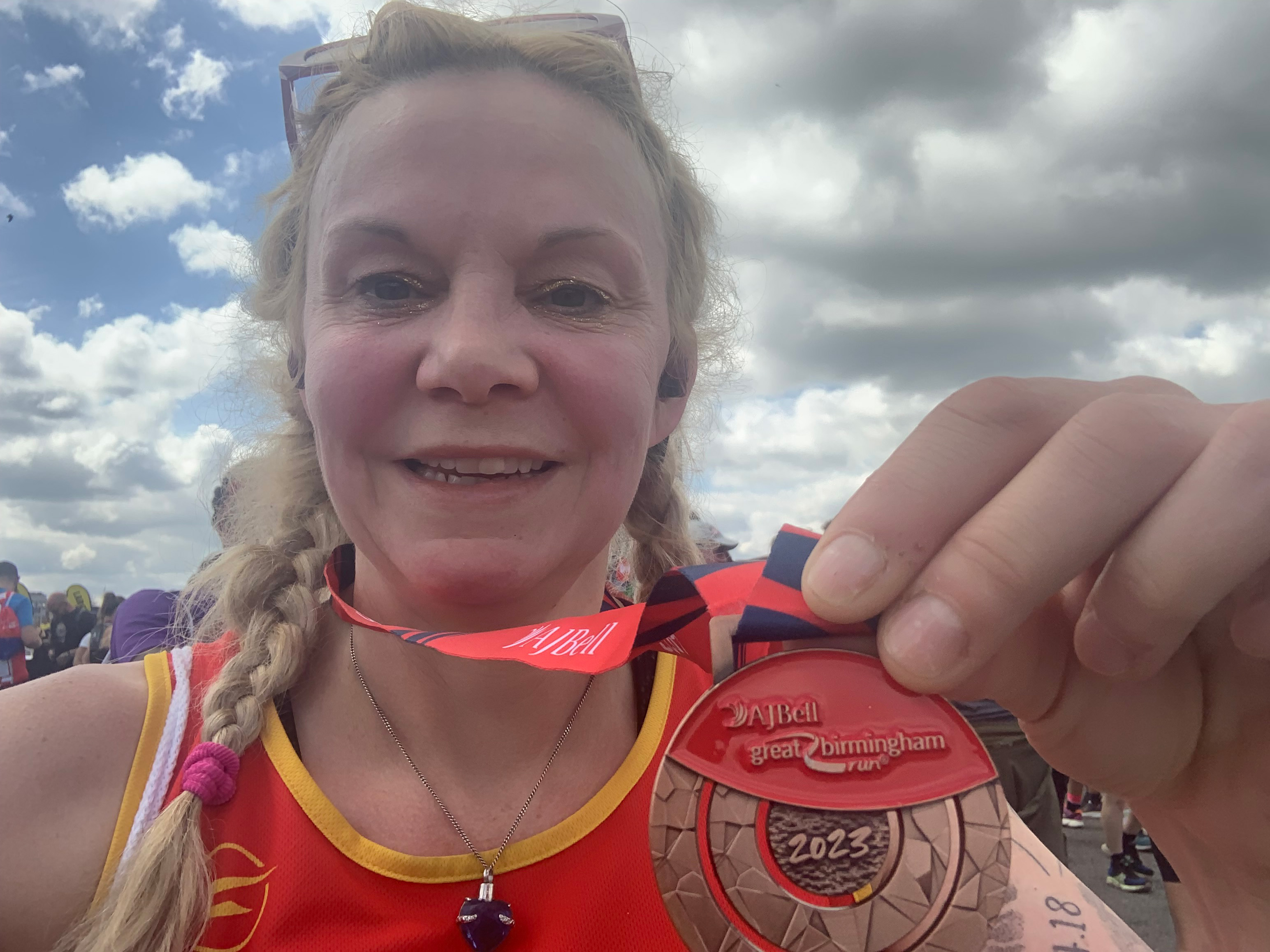 Freya who is running the Brighton marathon is pictured with a medal from the Great Birmingham Run